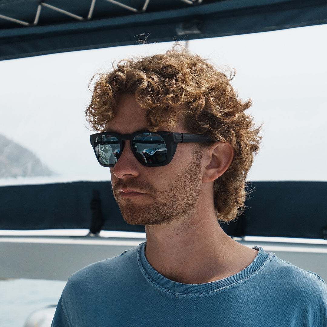 Jacob on a sailboat, wearing basn5 Davenport