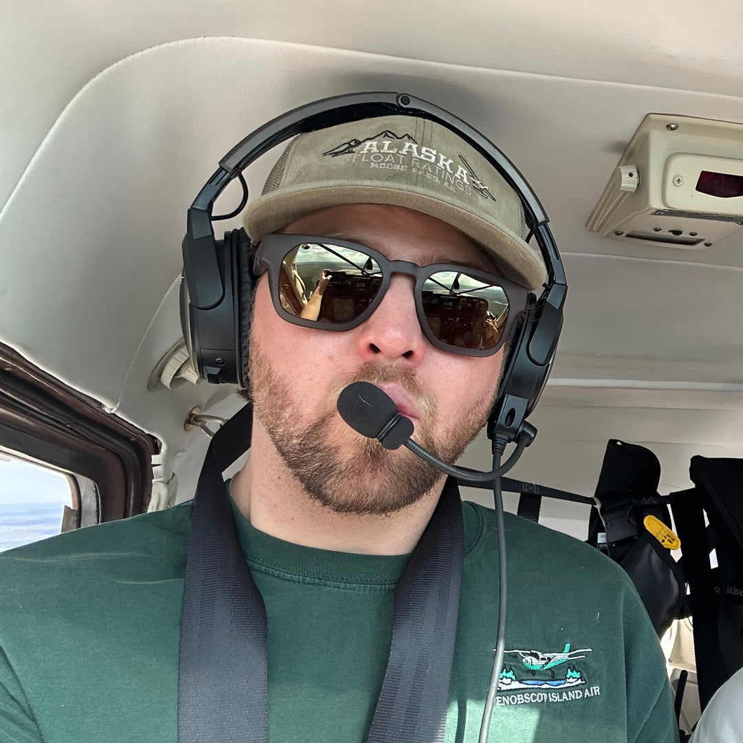 In the cockpit of a floatplane, wearing basn5 Davenport
