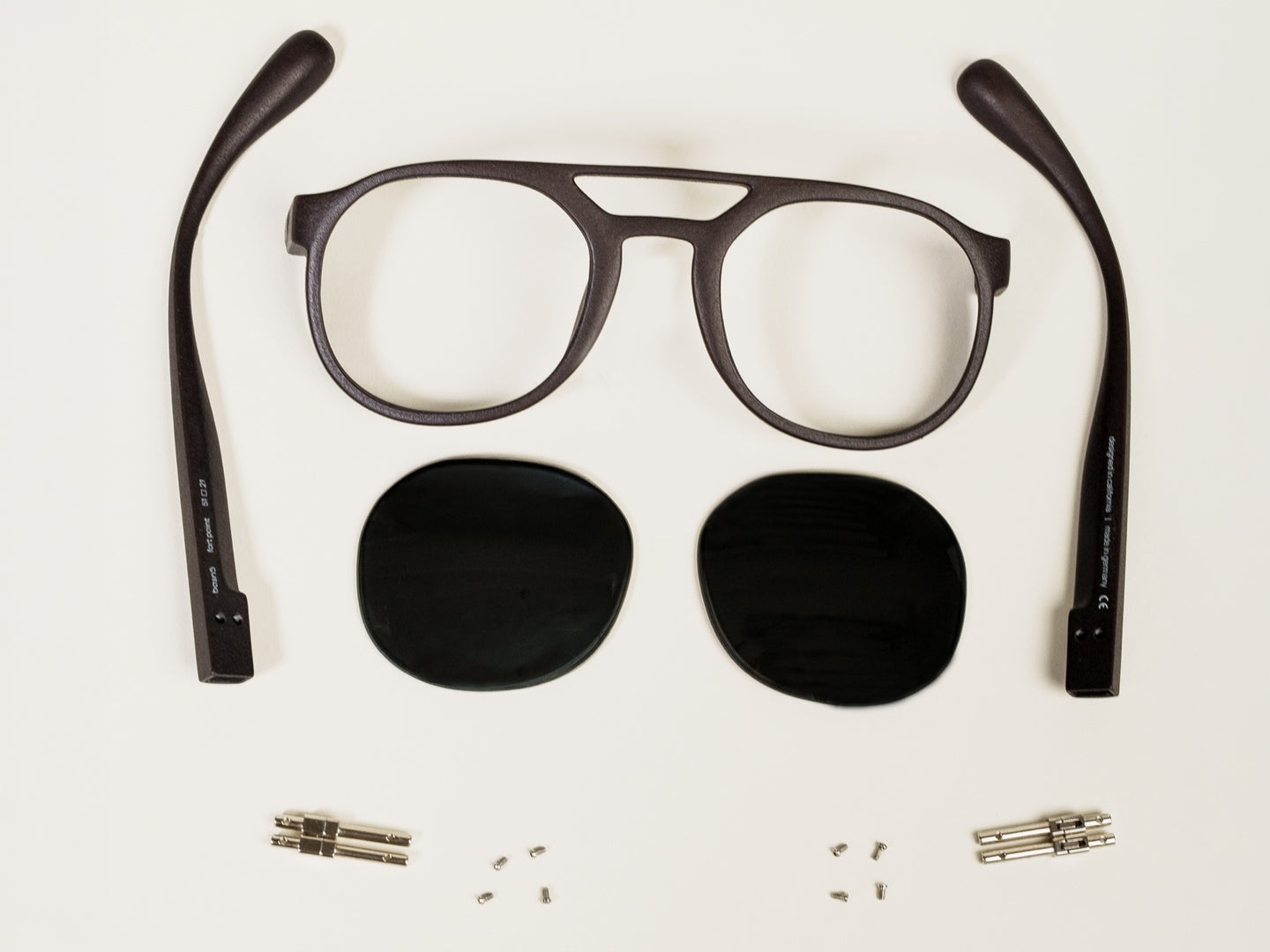 exploded view of fort point — temples, lenses, frame, hinges, and screws