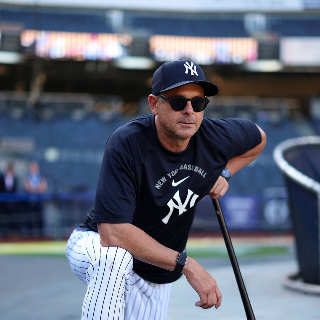 Aaron Boone holding a baseball bat, wearing Highway 1