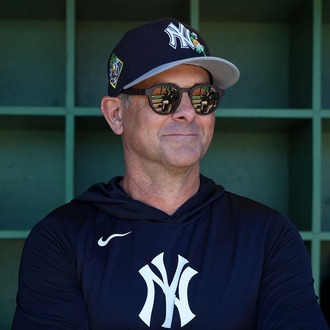 Aaron Boone in the dugout, wearing basn5 Highway 1